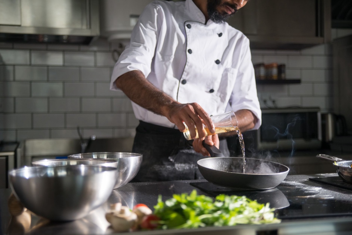 Sichuan chef preparing hot pot in restaurant