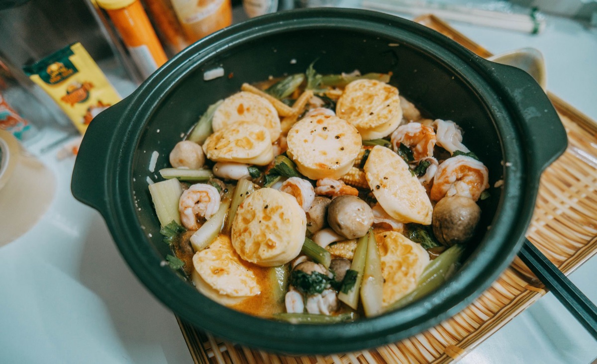 Chinese kitchen with simmering dishes and ingredients