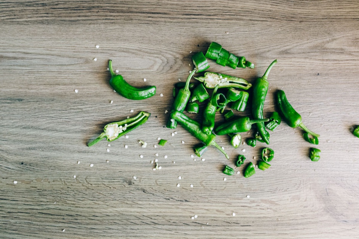 Sichuan peppercorn and chili pepper on wooden board