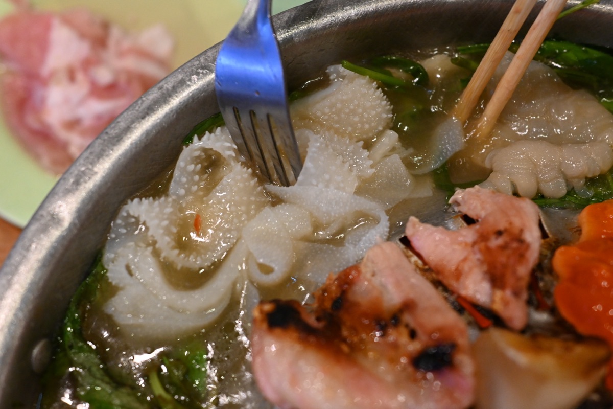 Steaming pot with chopsticks